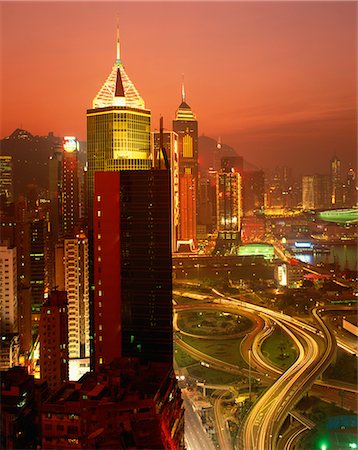 skyline at night with sunset - Illuminated buildings and lights of the city skyline at sunset in Hong Kong, China, Asia Stock Photo - Rights-Managed, Code: 841-02918427