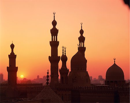 Domes and minarets silhouetted at sunset, Cairo, Egypt, North Africa, Africa Stock Photo - Rights-Managed, Code: 841-02918444