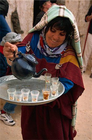 Berber woman pouring tea at troglodyte house, Matmata, Tunisia, North Africa, Africa Stock Photo - Rights-Managed, Code: 841-02918691