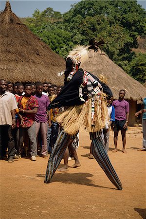 Stilt dancer watched by villagers, Ivory Coast, West Africa, Africa Stock Photo - Rights-Managed, Code: 841-02918789