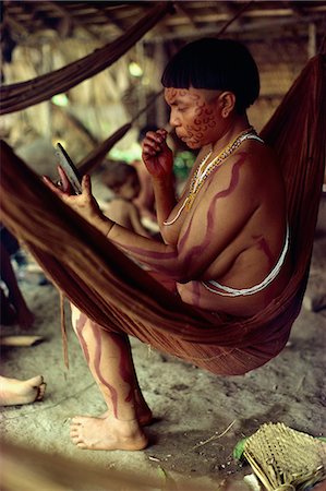Yanomami Indian women with mirror, painting her face, Brazil, South America Stock Photo - Rights-Managed, Code: 841-02924009