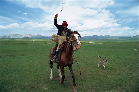 sheep dog - Wild Kirghiz nomad on horse with sheep, Lake Son-Kul, Kyrgyzstan, Central Asia, Asia Stock Photo - Rights-Managed, Code: 841-02924144