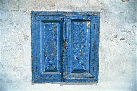 Blue window shutters and white walls, Simi (Symi), Dodecanese Islands, Greek Islands, Greece, Europe Stock Photo - Rights-Managed, Code: 841-02924830