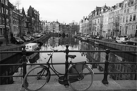 Black and white imge of an old bicycle by the Singel canal, Amsterdam, Netherlands, Europe Stock Photo - Rights-Managed, Code: 841-02925217