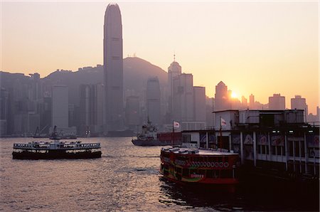 Star Ferry, Victoria Harbour and skyline of Hong Kong Island at sunset, Hong Kong, China, Asia Stock Photo - Rights-Managed, Code: 841-02925361