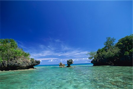 pacific islands - Sheltered lagoon and limestone islet, Lau group (Exploring Isles), Northern Lau Group. Fiji, Pacific Islands, Pacific Stock Photo - Rights-Managed, Code: 841-02925485