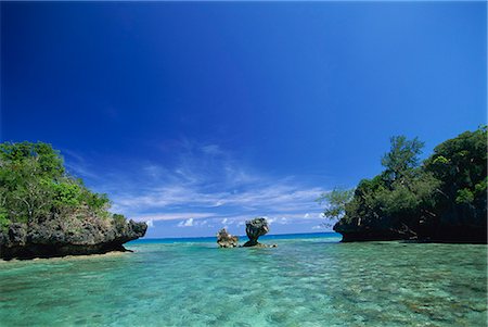 pacific islands - Sheltered lagoon and limestone islet, Lau group (Exploring Isles), Northern Lau Group. Fiji, Pacific Islands, Pacific Foto de stock - Con derechos protegidos, Código: 841-02925485