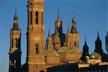 The towers, spires and tiled roogs of the Basilica of Nuestra Senora del Pilar at sunset, Zaragoza, Aragon, Spain, Europe Stock Photo - Rights-Managed, Code: 841-02920802