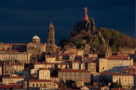 Houses and churches overlooked by a hilltop statue of the Virgin and child at Le Puy, Auvergne, France, Europe Stock Photo - Rights-Managed, Code: 841-02944779