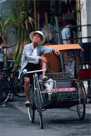 singapore transportation - Cycle taxi rider resting, Singapore, Southeast Asia, Asia Stock Photo - Rights-Managed, Code: 841-02944886