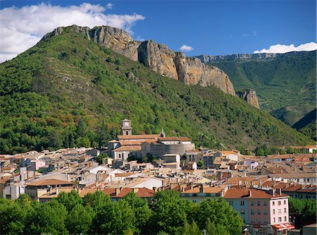 Houses and church with bell tower below a rocky hill at Digne les Bains, Alpes de Haute Provence, Provence, France, Europe Stock Photo - Rights-Managed, Code: 841-02945157