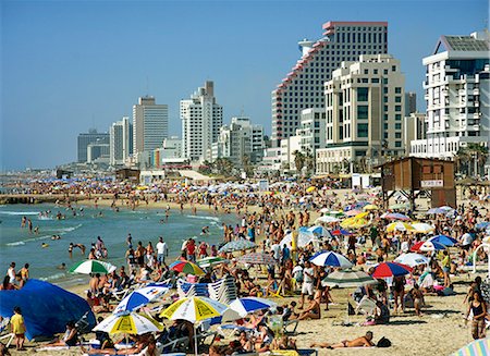 simsearch:841-02945718,k - Crowds of tourists on the beach with tall seafront buildings, at Tel Aviv, Israel, Middle East Stock Photo - Rights-Managed, Code: 841-02945752