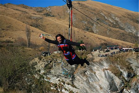 Flying fox, flying on wire over canyon, Queenstown, South Island, New Zealand, Pacific Stock Photo - Rights-Managed, Code: 841-02945996