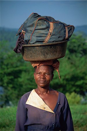 african woman carrying basket on head