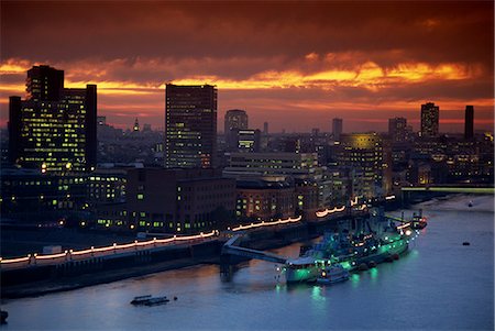 HMS Belfast moored on the Thames, illuminated at dusk, London, England, United Kingdom, Europe Stock Photo - Rights-Managed, Code: 841-02946144