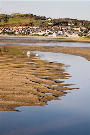 Exposed rippled sandbank on Conwy River estuary at low tide, with Deganwy beyond, Conwy, Wales, United Kingdom, Europe Stock Photo - Rights-Managed, Code: 841-02946244