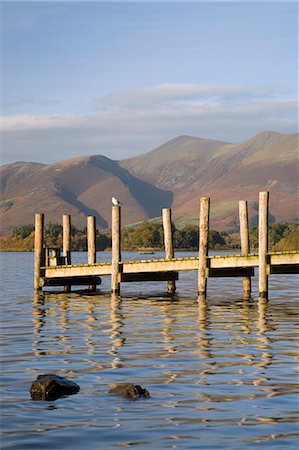 dock posts - Wooden jetty at Barrow Bay landing on Derwent Water looking north to Skiddaw in autumn, Keswick, Lake District National Park, Cumbria, England, United Kingdom, Europe Stock Photo - Rights-Managed, Code: 841-02946252