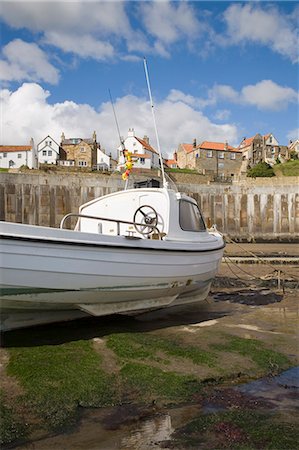 simsearch:841-03517184,k - White boat on The Landing in harbour at low tide with Old Bay area of fishing village above coastal defence sea wall behind, Robin Hood's Bay, Yorkshire, England, United Kingdom, Europe Stock Photo - Rights-Managed, Code: 841-02946260
