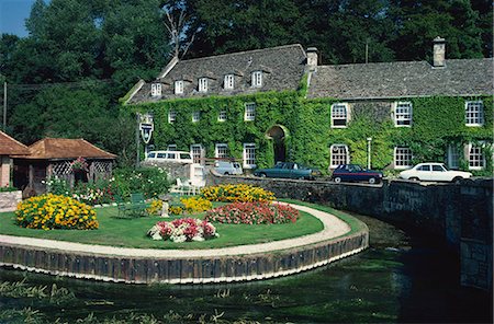 Swan Hotel on a bend in the River Coln, Bibury, Gloucestershire, The Cotswolds, England, United Kingdom, Europe Stock Photo - Rights-Managed, Code: 841-02946452