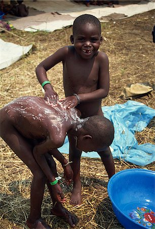 democratic republic of the congo - Portrait of two young children washing outdoors, Goma, Zaire, Africa Stock Photo - Rights-Managed, Code: 841-02947079