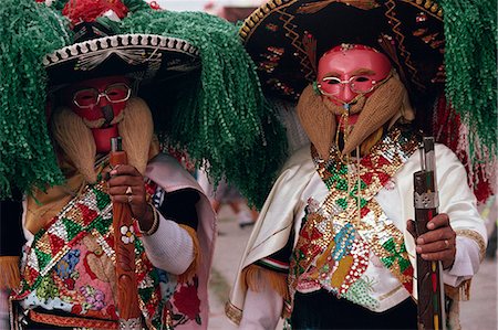 sombreros - Portrait of two men wearing masks, costumes, sombreros and carrying guns, during the Huejotzingo Carnival in Mexico, North America Stock Photo - Rights-Managed, Code: 841-02947176