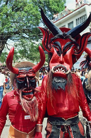 simsearch:841-02921031,k - Portrait of two people with devil masks, wearing red, looking at the camera, during Easter celebrations at Ciudad Santos in Mexico, North America Foto de stock - Con derechos protegidos, Código: 841-02947199