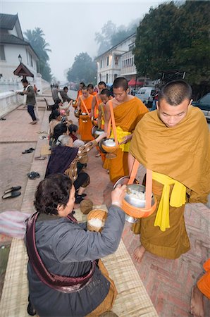 Monks collecting food at 7am, Luang Prabang, Laos, Indochina, Southeast Asia, Asia Stock Photo - Rights-Managed, Code: 841-02947284