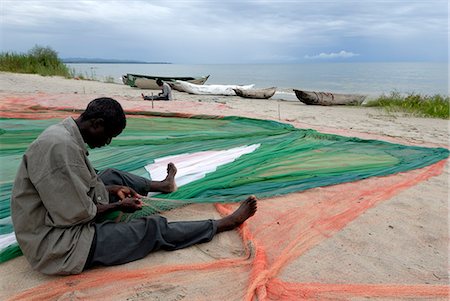 portrait fisherman with net - Fisherman, Chintheche Beach, Lake Malawi, Malawi, Africa Stock Photo - Rights-Managed, Code: 841-02943673