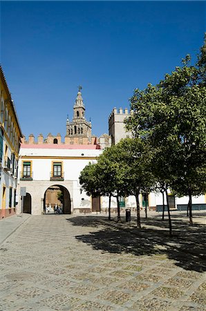 real alcazar - Plaza just outside the exit to the Real Alcazar with La Giralda in background, Santa Cruz district, Seville, Andalusia (Andalucia), Spain, Europe Stock Photo - Rights-Managed, Code: 841-02994220