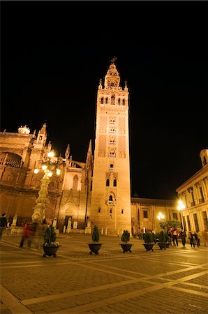 La Giralda and Seville Cathedral at night, Plaza Virgen de los Reyes, Santa Cruz district, Seville, Andalusia, Spain, Europe Stock Photo - Rights-Managed, Code: 841-02994319