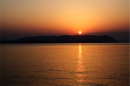 Sunset over the Aegean, taken from Loutraki, Skopelos, with Skiathos in background, Sporades Islands, Greek Islands, Greece, Europe Stock Photo - Rights-Managed, Code: 841-02991231