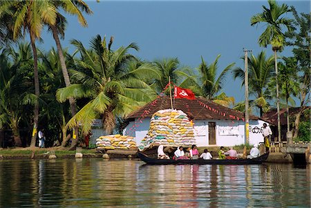 Small boat passing Communist flag, Backwaters, Kerala state, India, Asia Stock Photo - Rights-Managed, Code: 841-02991523