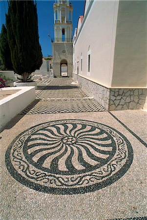 Design in cobbled pavement by St. Nicholas church, Chalki (Halki), Dodecanese, Greek Islands, Greece, Europe Stock Photo - Rights-Managed, Code: 841-02991632