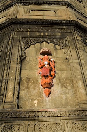 sculptures of indian gods - Hindu temple god on wall on banks of the Narmada River, Maheshwar, Madhya Pradesh state, India, Asia Stock Photo - Rights-Managed, Code: 841-02992257