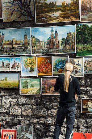 Paintings displayed on the old city walls near Florians's Gate, Krakow (Cracow), Poland, Europe Fotografie stock - Rights-Managed, Codice: 841-02992809