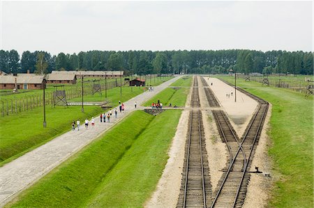 Railway line and platform where prisoners were unloaded and separated into able bodied men, kept for work, and woman and children who were taken to gas chambers, Auschwitz second concentration camp at Birkenau, UNESCO World Heritage Site, near Krakow (Cracow), Poland, Europe Stock Photo - Rights-Managed, Code: 841-02992893