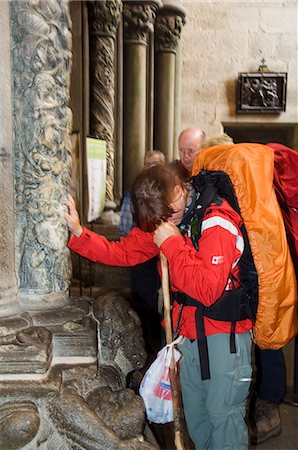 santiago cathedral - Pilgrims touching a column on the Porch of La Gloria, Santiago Cathedral, Santiago de Compostela, Galicia, Spain, Europe Stock Photo - Rights-Managed, Code: 841-02993201