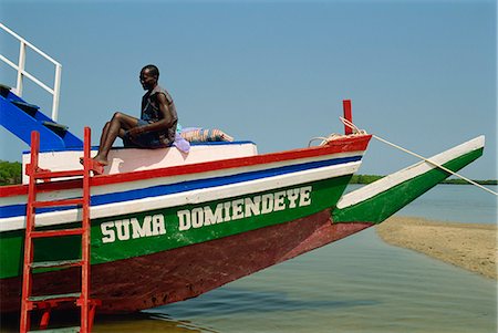 Tourist boat on backwaters near Banjul, Gambia, West Africa, Africa Stock Photo - Rights-Managed, Code: 841-02993297