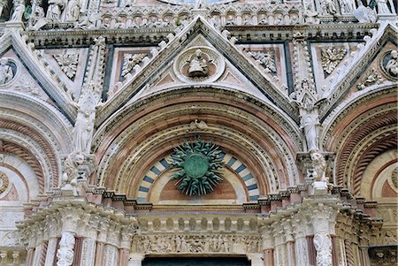 simsearch:841-03673270,k - Gothic detail on the facade of the Duomo (Cathedral), including the sun symbol, Siena, UNESCO World Heritage Site, Tuscany, Italy, Europe Foto de stock - Con derechos protegidos, Código: 841-03028735