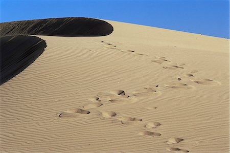 simsearch:841-02711753,k - Footprints in sand, Maspalomas beach, Gran Canaria, Canary Islands, Spain, Europe Stock Photo - Rights-Managed, Code: 841-03029846