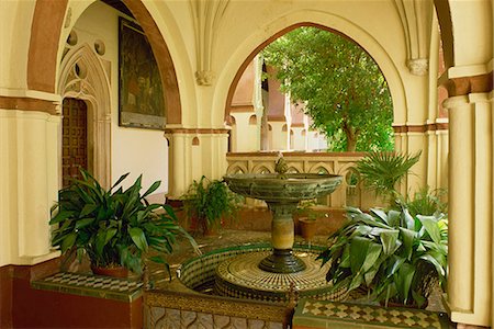 Interior with fountain and plants in the patio of the Christian Monastery of Guadalupe, Cacares, Extremadura, Spain, Europe Stock Photo - Rights-Managed, Code: 841-03030164