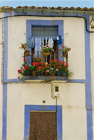 Exterior detail of a house painted blue and white, with geraniums on the small balcony, La Alberca, Castile Leon (Castilla Leon), Spain, Europe Stock Photo - Rights-Managed, Code: 841-03030410