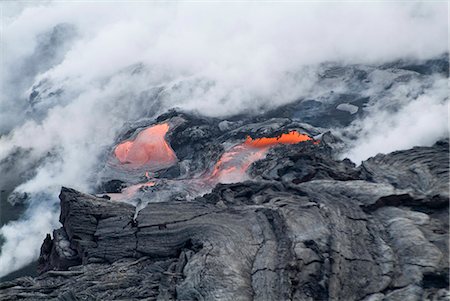 Steam plumes from hot lava flowing onto beach and into the ocean, Kilauea Volcano, Hawaii Volcanoes National Park, UNESCO World Heritage Site, Island of Hawaii (Big Island), Hawaii, United States of America, North America Stock Photo - Rights-Managed, Code: 841-03030675