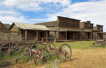Old western wagons, restored storefronts, homes and saloons from the pioneering days of the Wild West at Cody, Montana, United States of America, North America Stock Photo - Rights-Managed, Code: 841-03032354