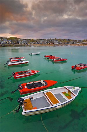 saint ives - Strange cloud formation in a stormy sky at sunset, with small red speedboats for hire with an incoming tide in the harbour at St. Ives, Cornwall, England, United Kingdom, Europe Stock Photo - Rights-Managed, Code: 841-03032455
