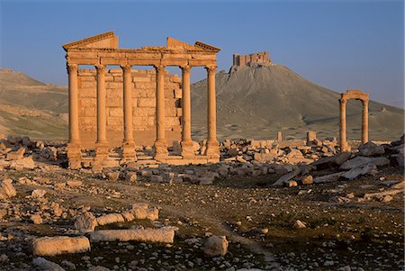 funerary - Funerary temple at archaeological site and Arab castle beyond, Palmyra, UNESCO World Heritage Site, Syria, Middle East Stock Photo - Rights-Managed, Code: 841-03033125