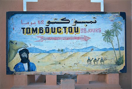sahara camel - Painted road sign pointing in the direction of Tombouctou (Timbuktu), in the town of Zagora, Vallee du Draa (Draa Valley), Anti Atlas, Morocco, North Africa, Africa Stock Photo - Rights-Managed, Code: 841-03033156