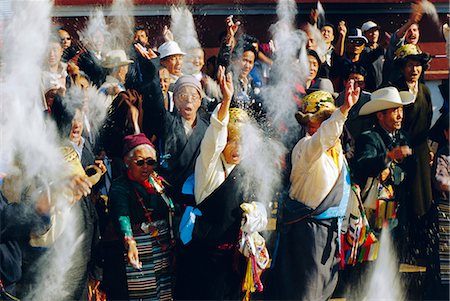 simsearch:841-03031815,k - Buddhist people throwing flour into the air, symbolising the Buddha's wisdom, during the Losar (Tibetan New Year), Bodhnath, Katmandu, Nepal Stock Photo - Rights-Managed, Code: 841-03033494
