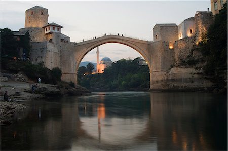 Stari Most Peace Bridge and reflection of mosque on Neretva River, Mostar, Bosnia, Bosnia-Herzegovina, Europe Stock Photo - Rights-Managed, Code: 841-03054844