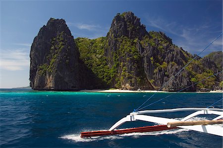 palawan - Island hopping by catamaran around coral fringe in clear waters, Bacuit Bay, El Nido Town, Palawan, Philippines, Southeast Asia, Asia Foto de stock - Con derechos protegidos, Código: 841-03055174